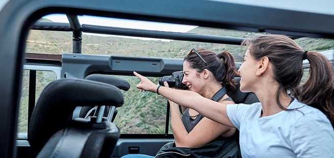 Girlfriends in the car on the private Jeep Safari to Masca excursion