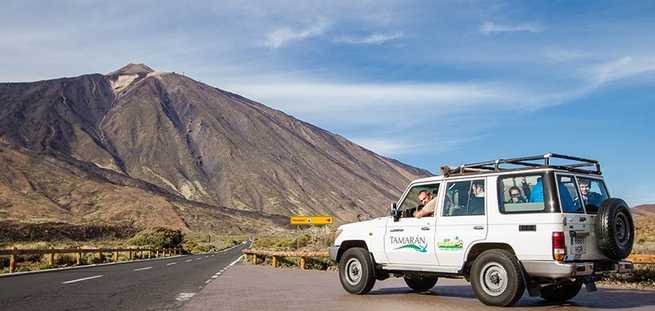Vehicle and the view of Mount Teide on the Jeep Safari excursion